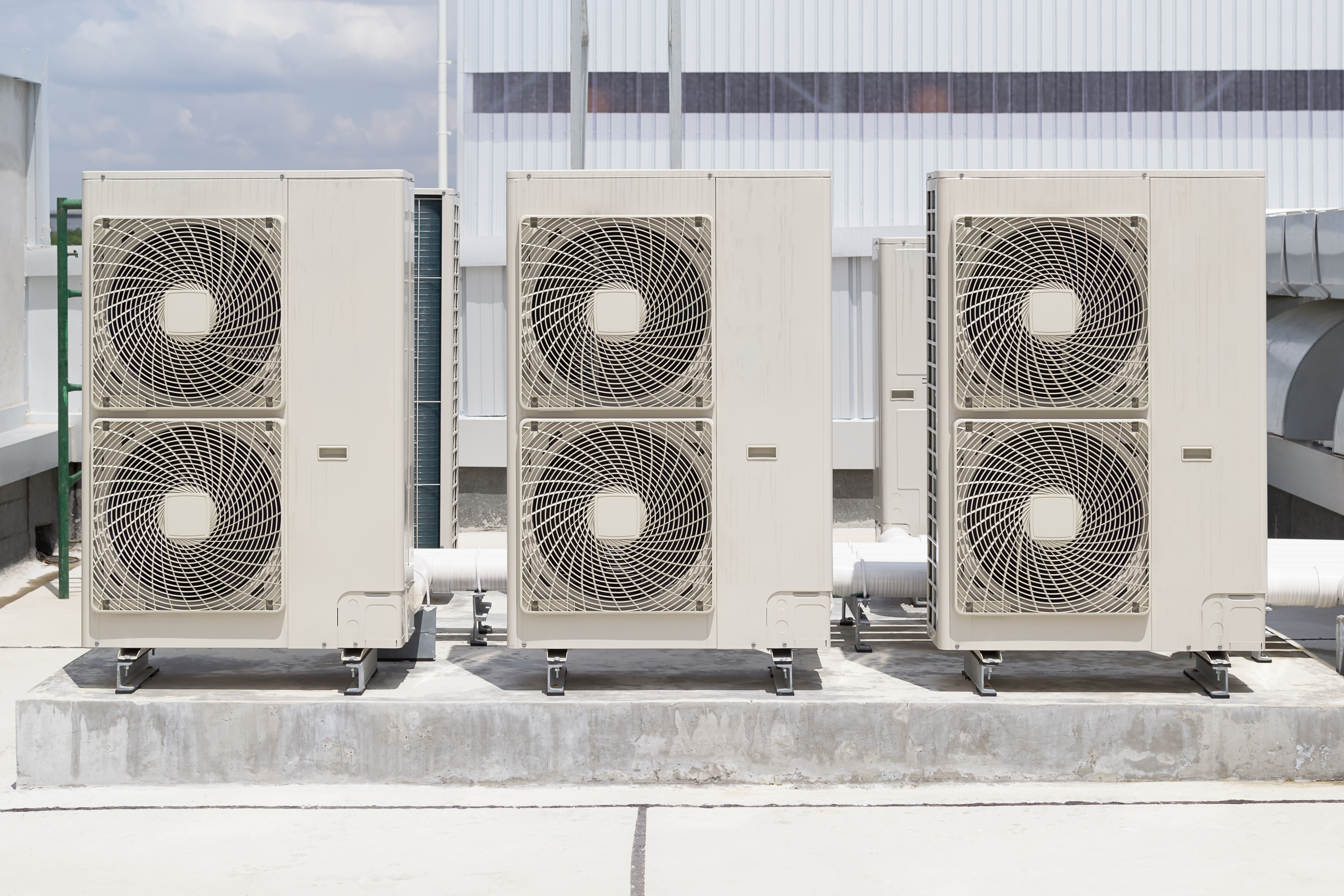 Large commercial HVAC outdoor units installed on a rooftop, ensuring efficient climate control for a building.